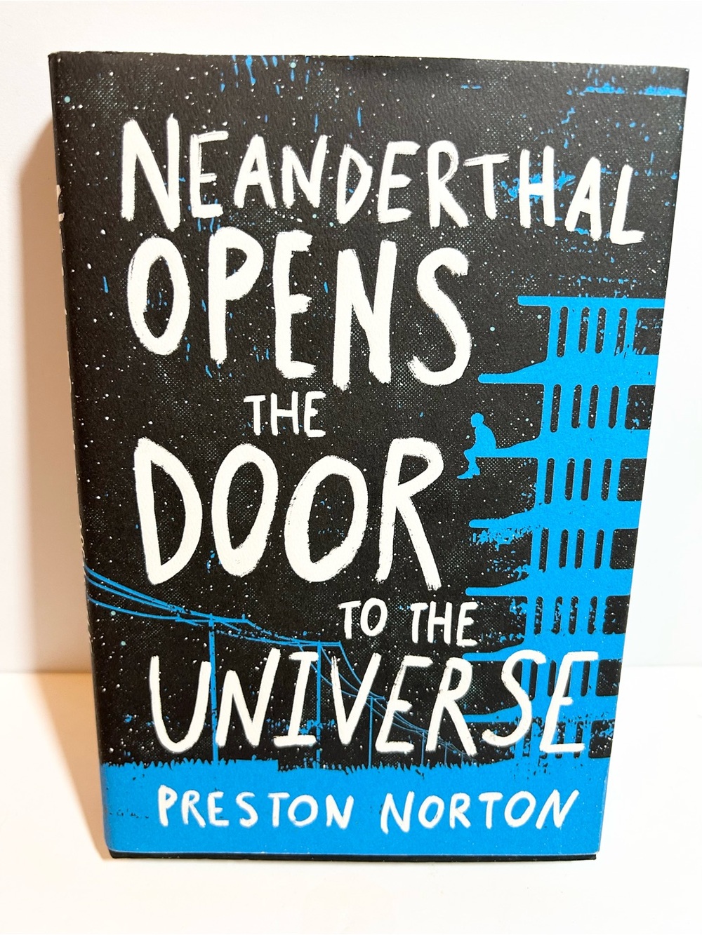 Neanderthal Opens the Door to the Universe Hardcover Book by Preston Norton